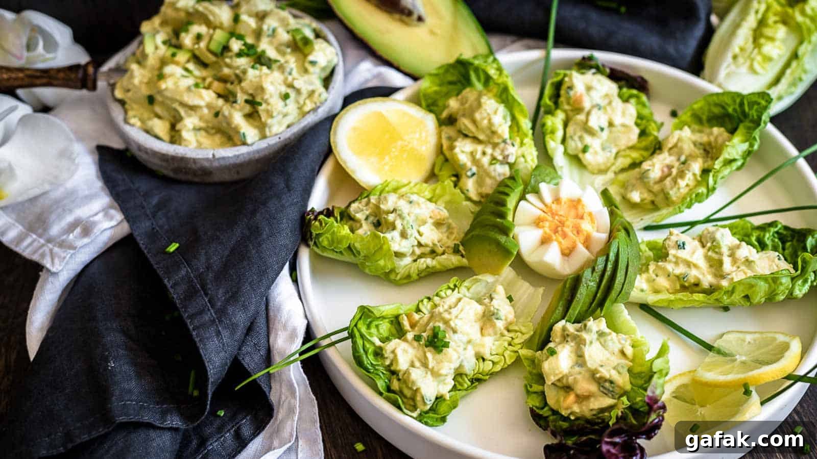 21 Packed Lunch Ideas to Make Midday Meals Exciting Again 10 Avocado Egg Salad on a salad leaves.