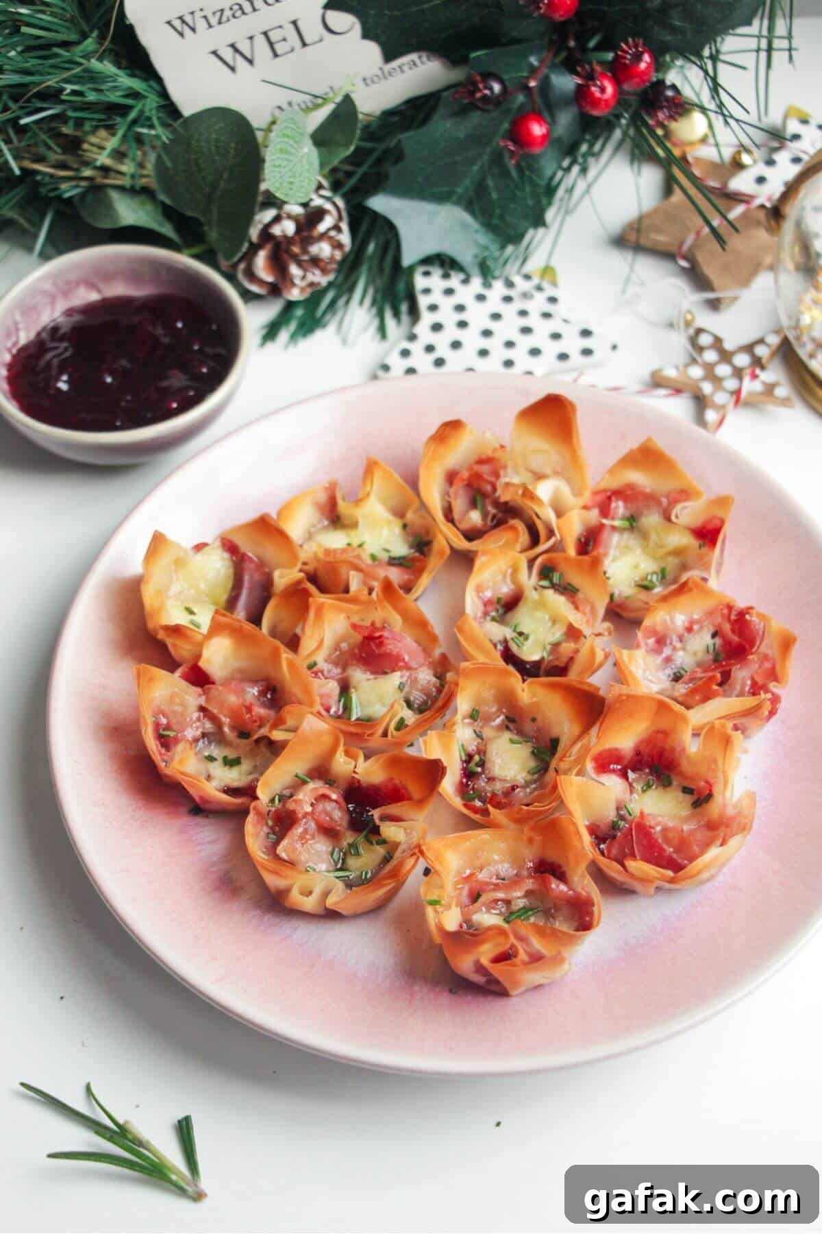 Brie filo bites on a small pink plate.