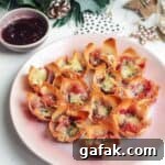Brie filo bites on a small pink plate.