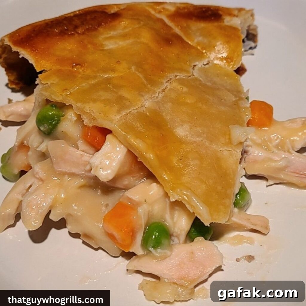 Smoked Turkey Pot pie slice on a white plate
