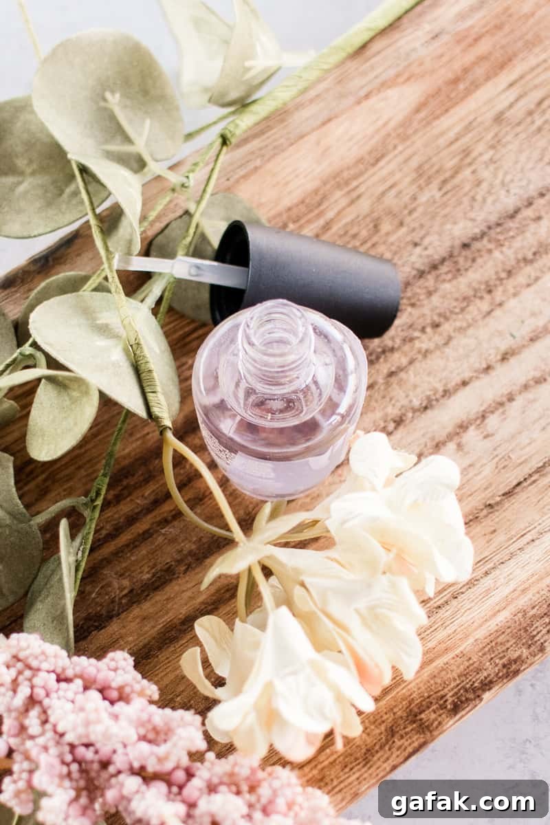 Using a cuticle oil to hydrate my toenails.