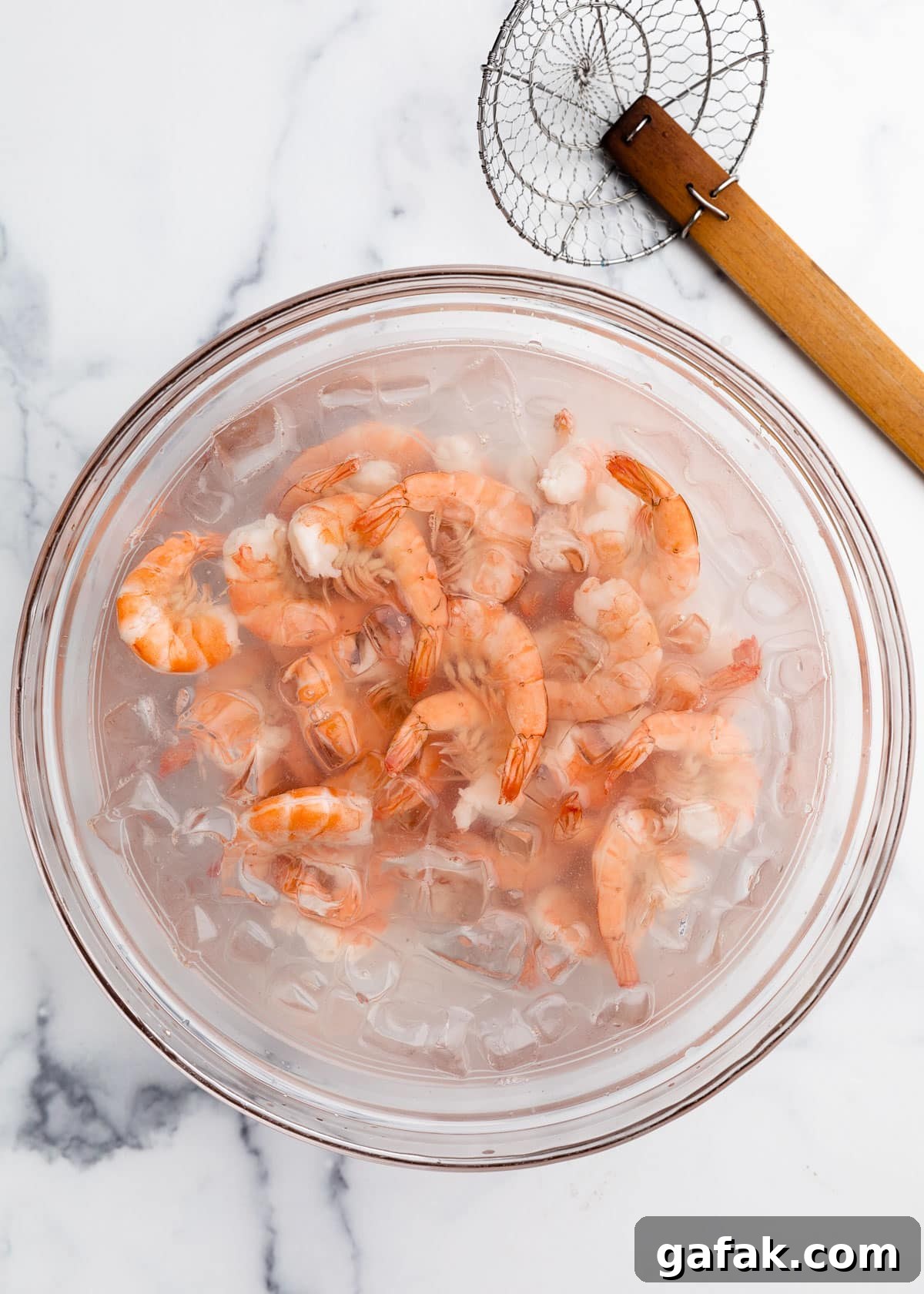 How to Poach Shrimp Perfectly Every Time 11 poached shrimp in an ice bath