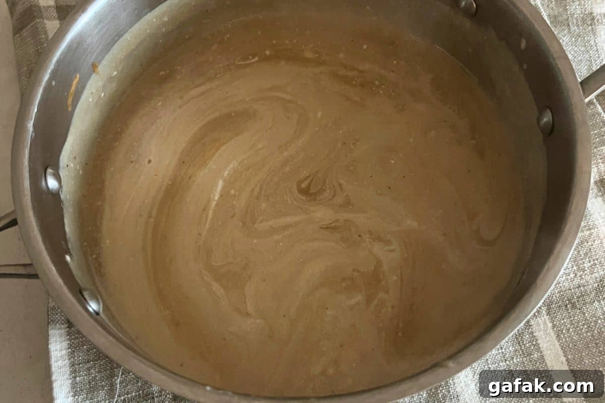 Beef stock and flour thickened in a pot