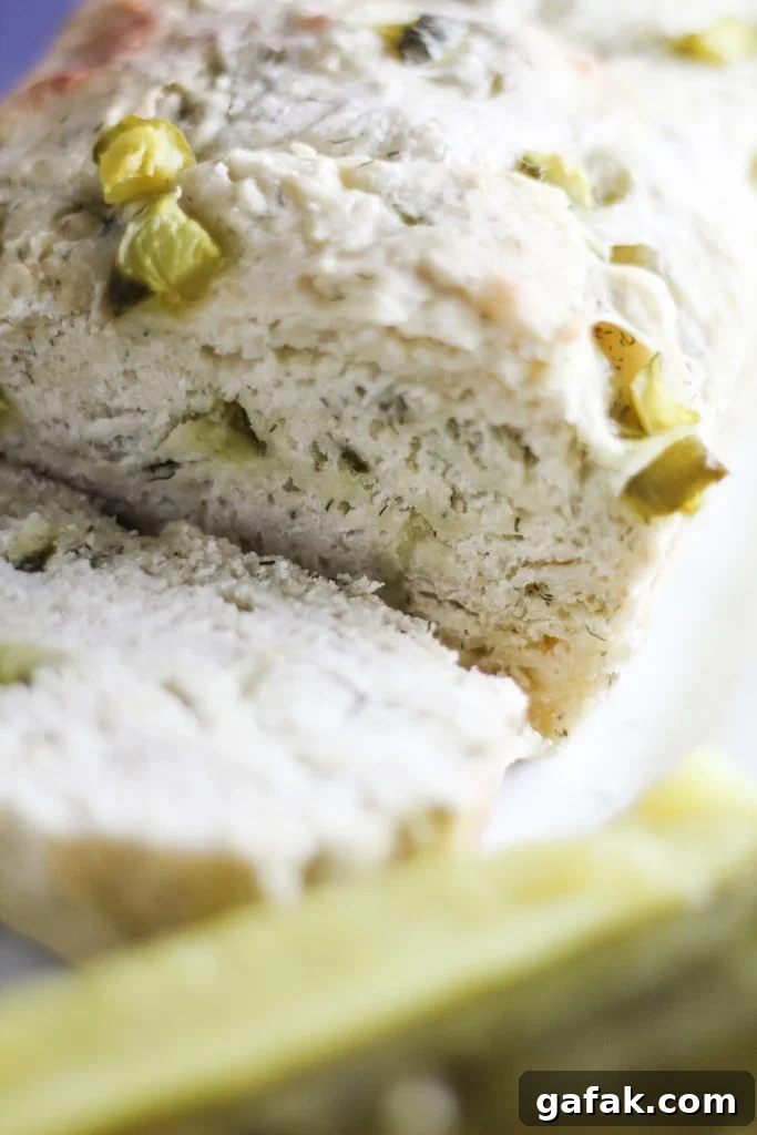 dill pickle bread shown sliced and served on a white platter