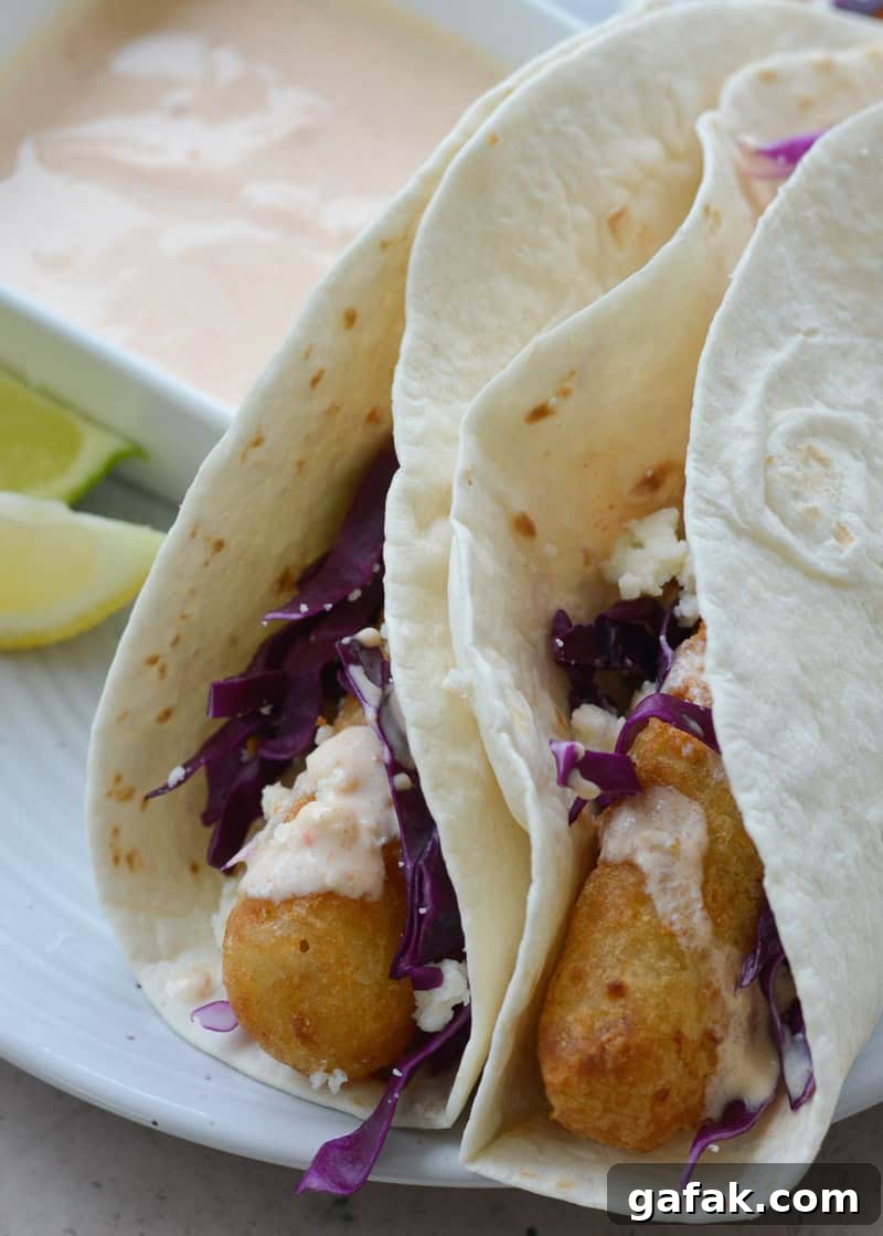 Crispy Air Fryer Fish Tacos with Lime Slaw 2 These easy Air Fryer Fish Tacos are ready in 20 minutes! Cooking frozen fish in the air fryer gives you perfectly crispy tacos with barely any work at all!