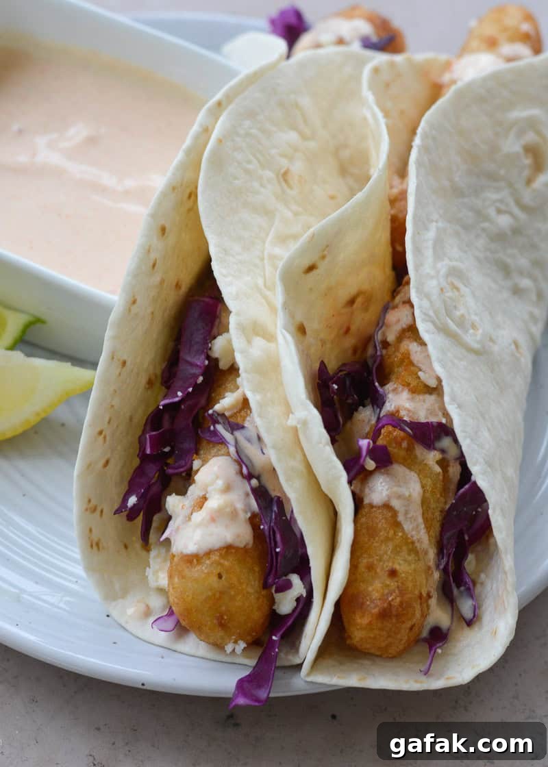 Crispy Air Fryer Fish Tacos with Lime Slaw 4 These easy Air Fryer Fish Tacos are ready in 20 minutes! Cooking frozen fish in the air fryer gives you perfectly crispy tacos with barely any work at all!