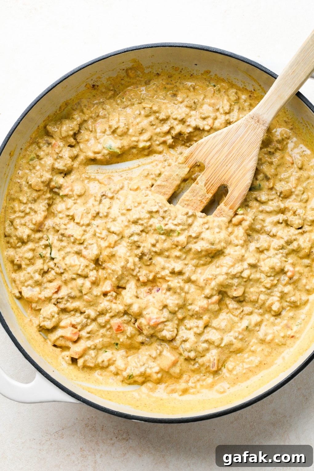 How to make Dairy Free Queso Fundido with Ground Beef: Queso with ground beef and pico de gallo all mixed together. 