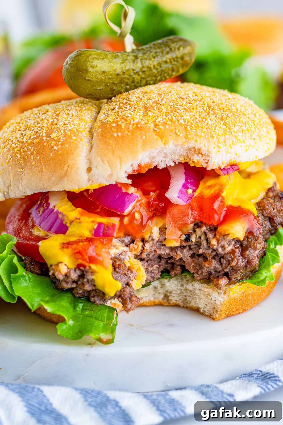 Bite taken out of Cheeseburger Recipe on platter