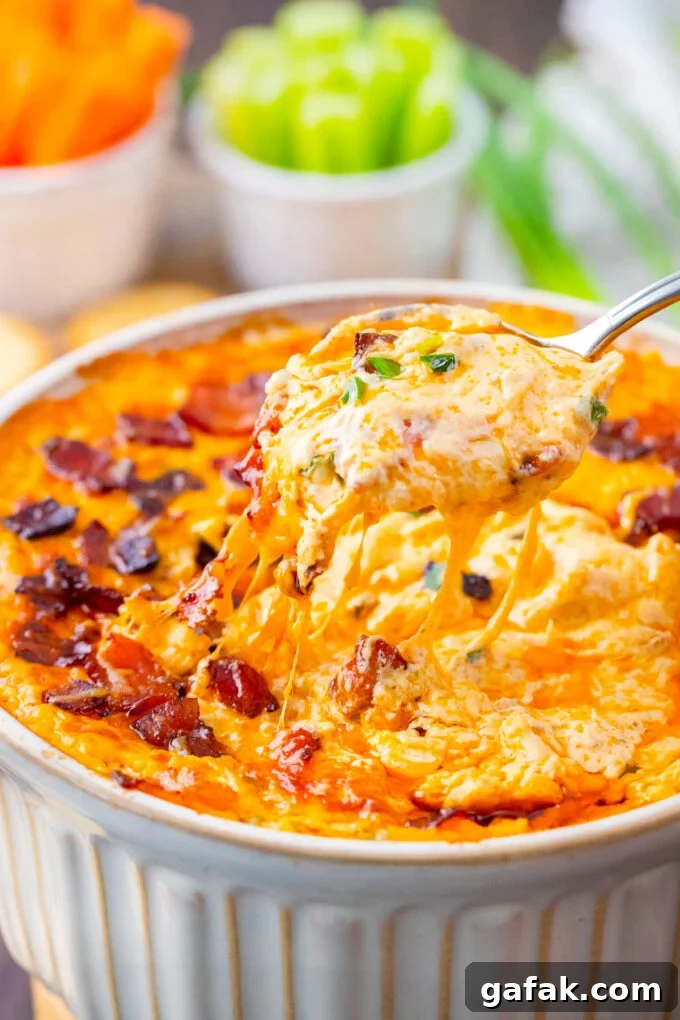 A spoonful of very cheesy, homemade Buffalo crack chicken dip/