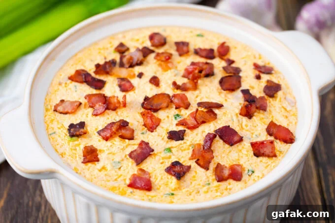 Buffalo crack chicken dip before baking it.