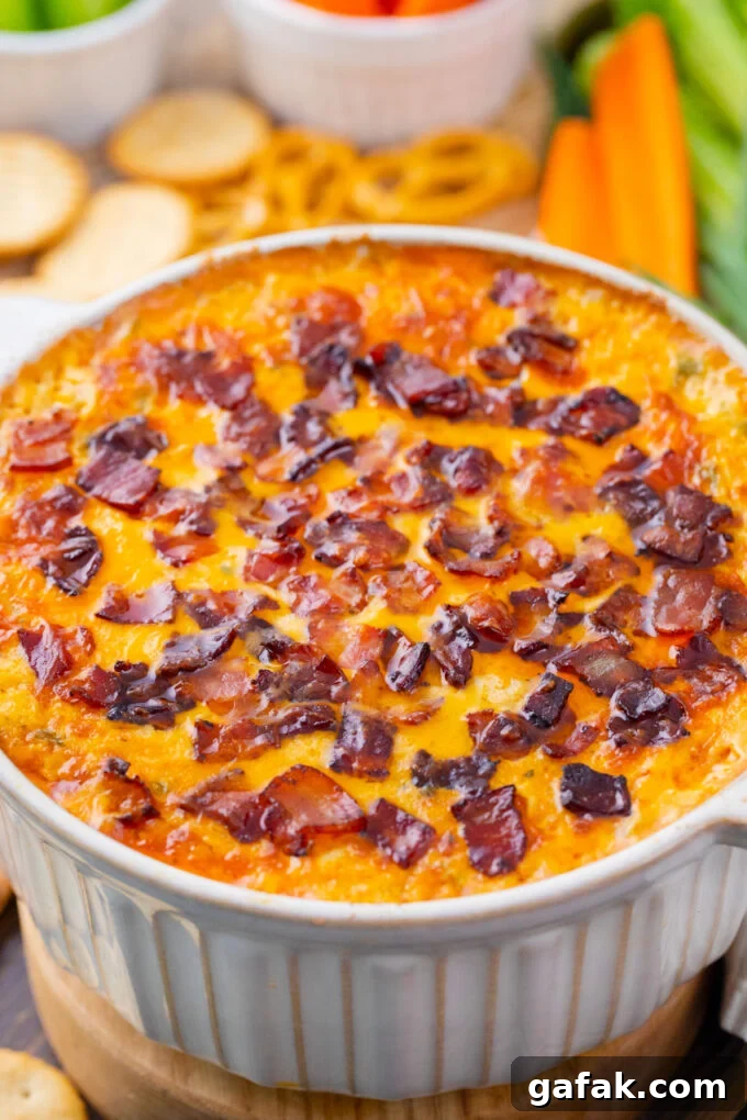 Perfectly baked Buffalo crack chicken dip with bacon.