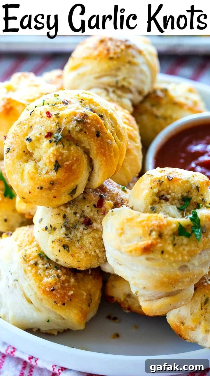 Garlic Knots piled up on a plate.