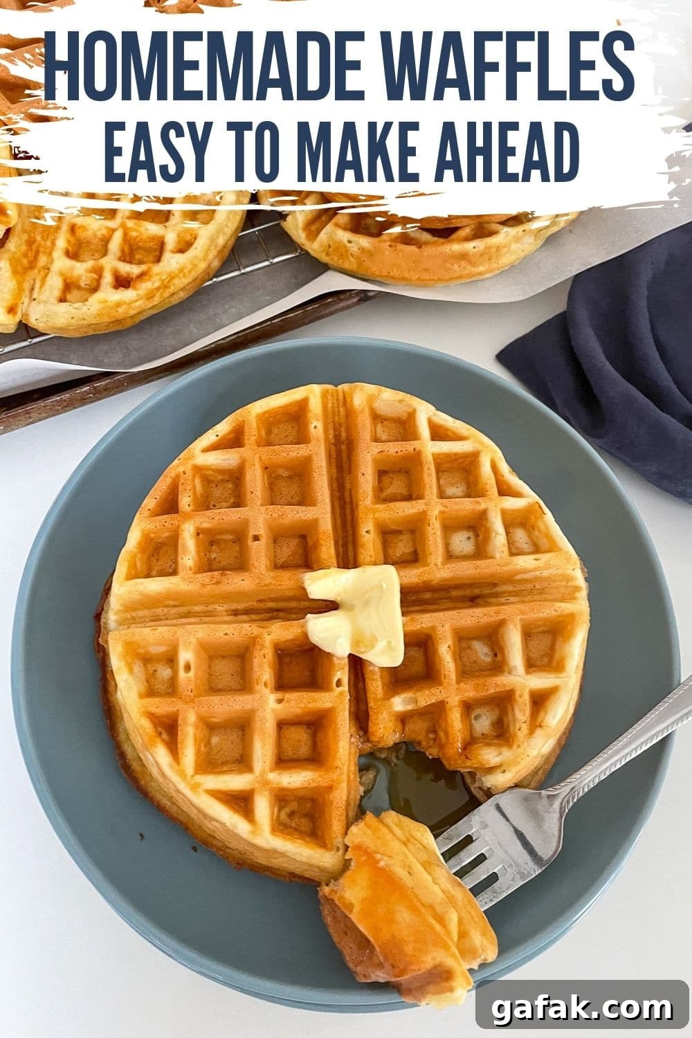 hero shot with a waffle and a pat of butter on a blue plate.