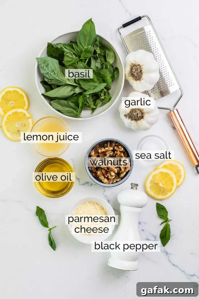 The ingredients in basil walnut pesto shown with labels.