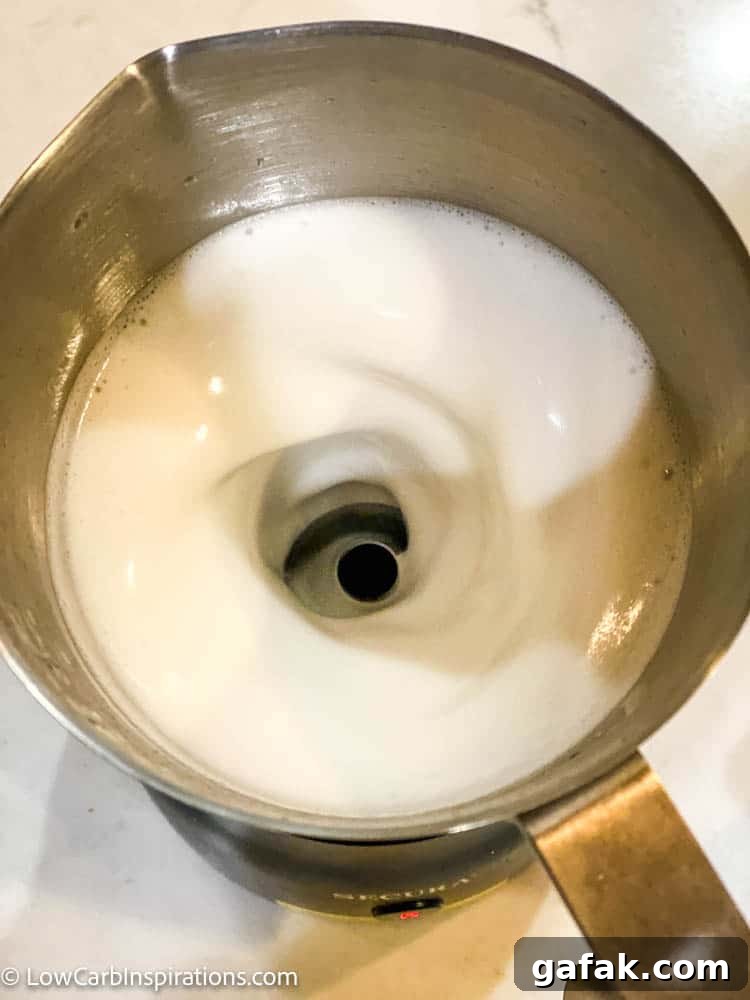 Milk frother in use
