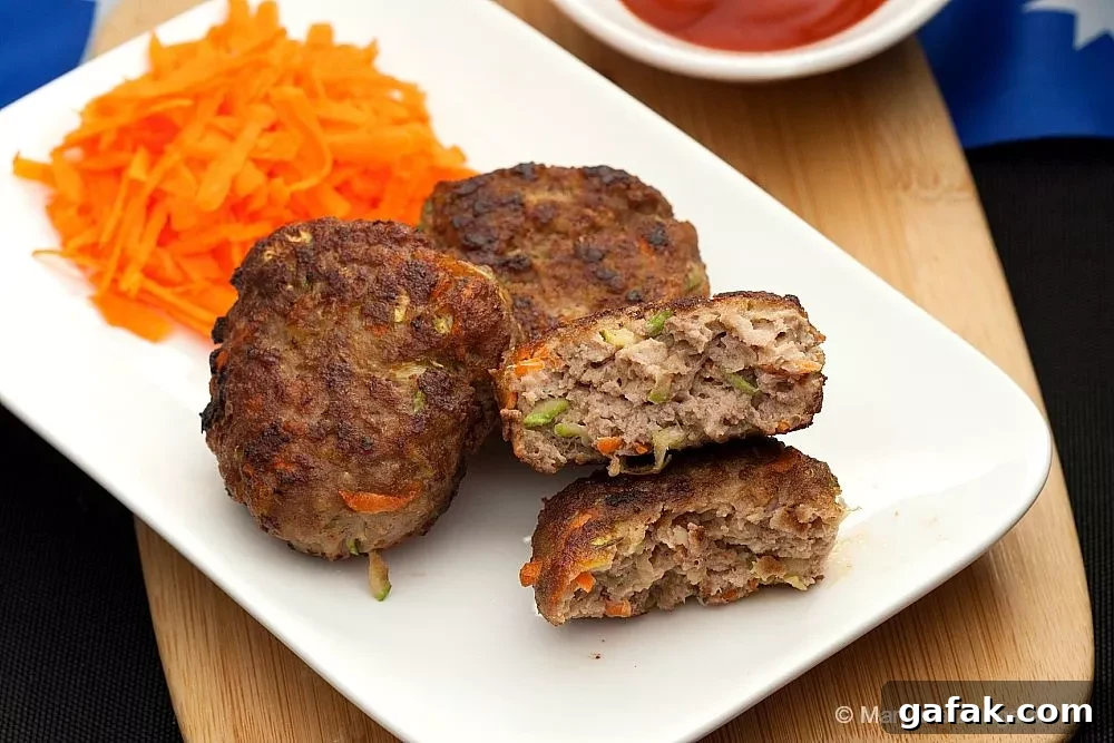 Rissoles: Crispy Filled Patties Recipe Guide 4 Cooked Australian rissoles with grated vegetables inside, served with carrot and tomato sauce.