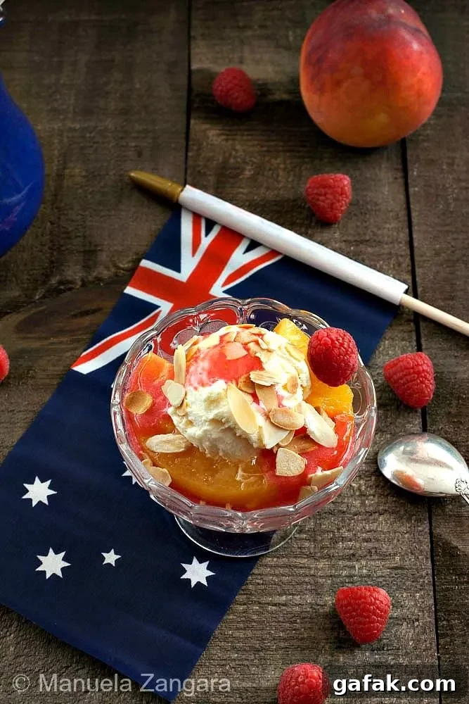 Rissoles: Crispy Filled Patties Recipe Guide 6 Peach Melba dessert topped with ice cream, almonds, and raspberries on an Australian flag napkin.