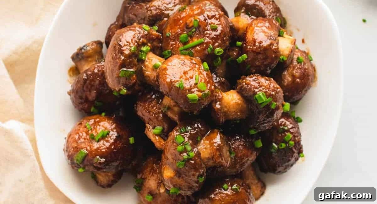 Overhead image of miso glazed mushrooms with garnish. 