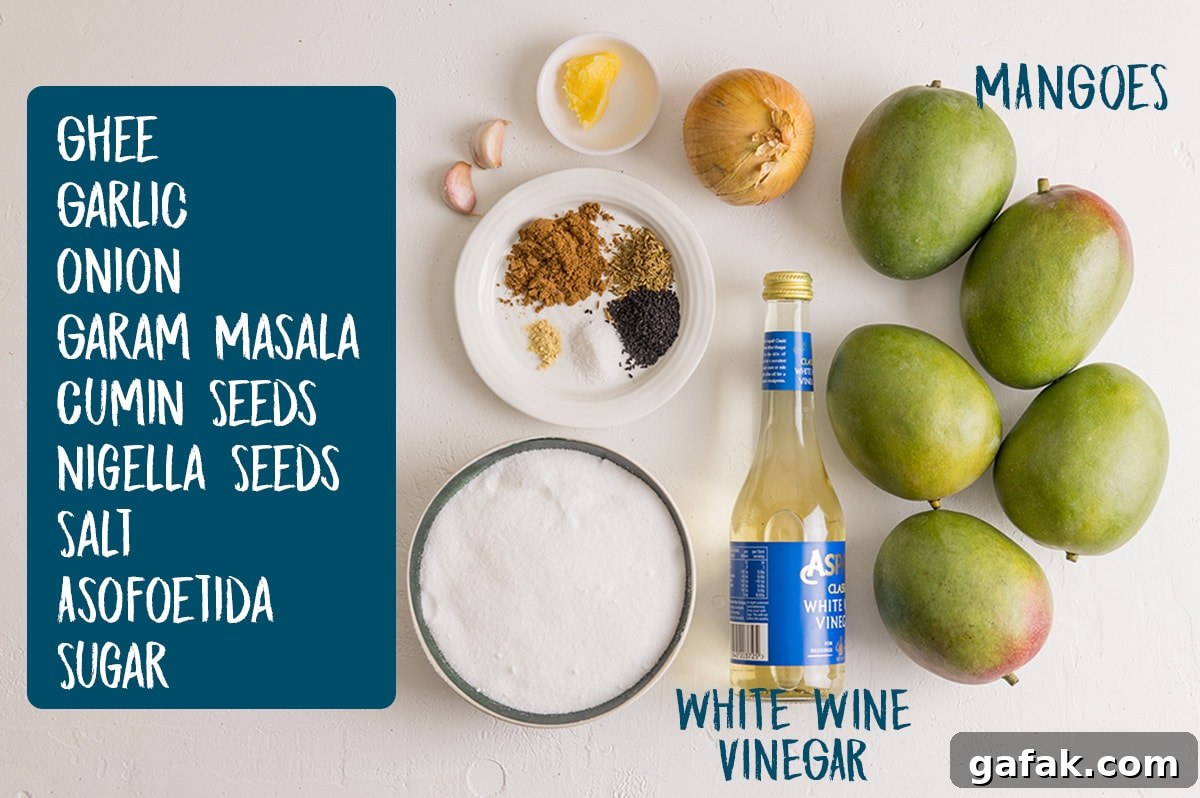 Ingredients for homemade mango chutney on a white board.