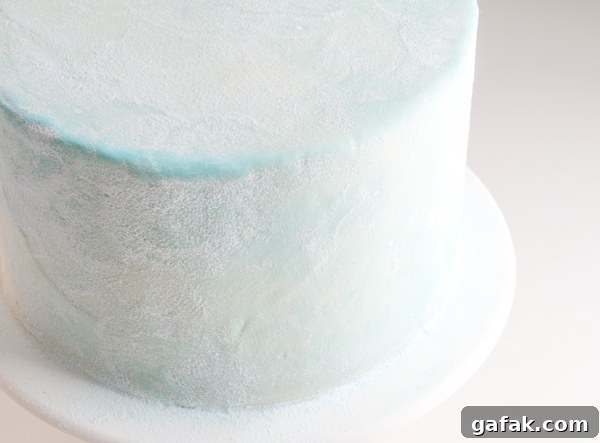 Sueded Buttercream Cake with Sprinkle Snowflakes | by Erin Gardner for TheCakeBlog.com #cake #winter #christmas #christmasdessert