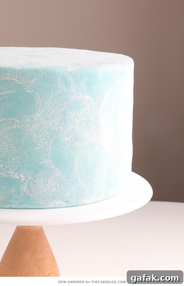 Sueded Buttercream Cake with Sprinkle Snowflakes | by Erin Gardner for TheCakeBlog.com #cake #winter #christmas #christmasdessert