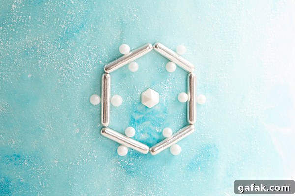 Sueded Buttercream Cake with Sprinkle Snowflakes | by Erin Gardner for TheCakeBlog.com #cake #winter #christmas #christmasdessert