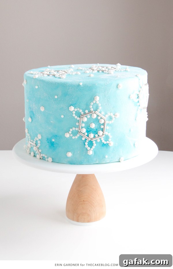 Sueded Buttercream Cake with Sprinkle Snowflakes | by Erin Gardner for TheCakeBlog.com #cake #winter #christmas #christmasdessert
