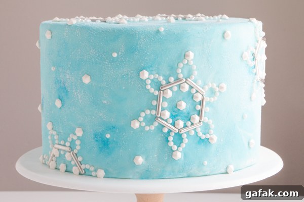 Sueded Buttercream Cake with Sprinkle Snowflakes | by Erin Gardner for TheCakeBlog.com #cake #winter #christmas #christmasdessert