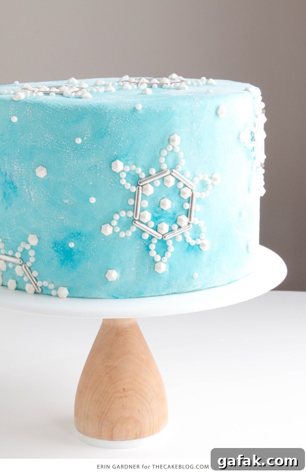 Sueded Buttercream Cake with Sprinkle Snowflakes | by Erin Gardner for TheCakeBlog.com #cake #winter #christmas #christmasdessert