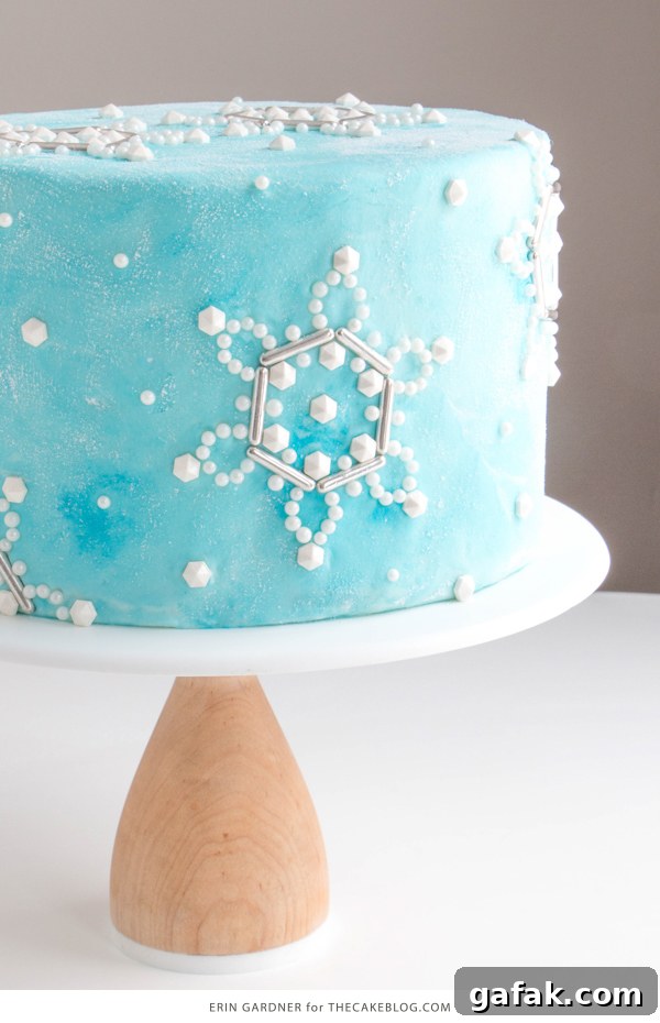 Sueded Buttercream Cake with Sprinkle Snowflakes | by Erin Gardner for TheCakeBlog.com #cake #winter #christmas #christmasdessert