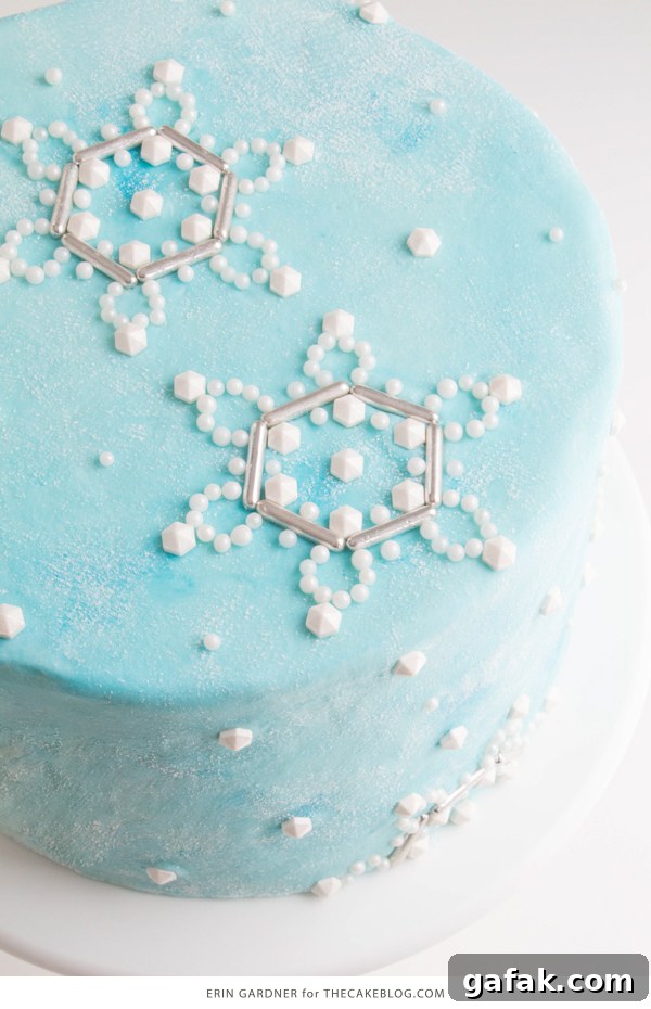 Sueded Buttercream Cake with Sprinkle Snowflakes | by Erin Gardner for TheCakeBlog.com #cake #winter #christmas #christmasdessert