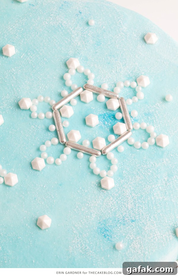 Sueded Buttercream Cake with Sprinkle Snowflakes | by Erin Gardner for TheCakeBlog.com #cake #winter #christmas #christmasdessert