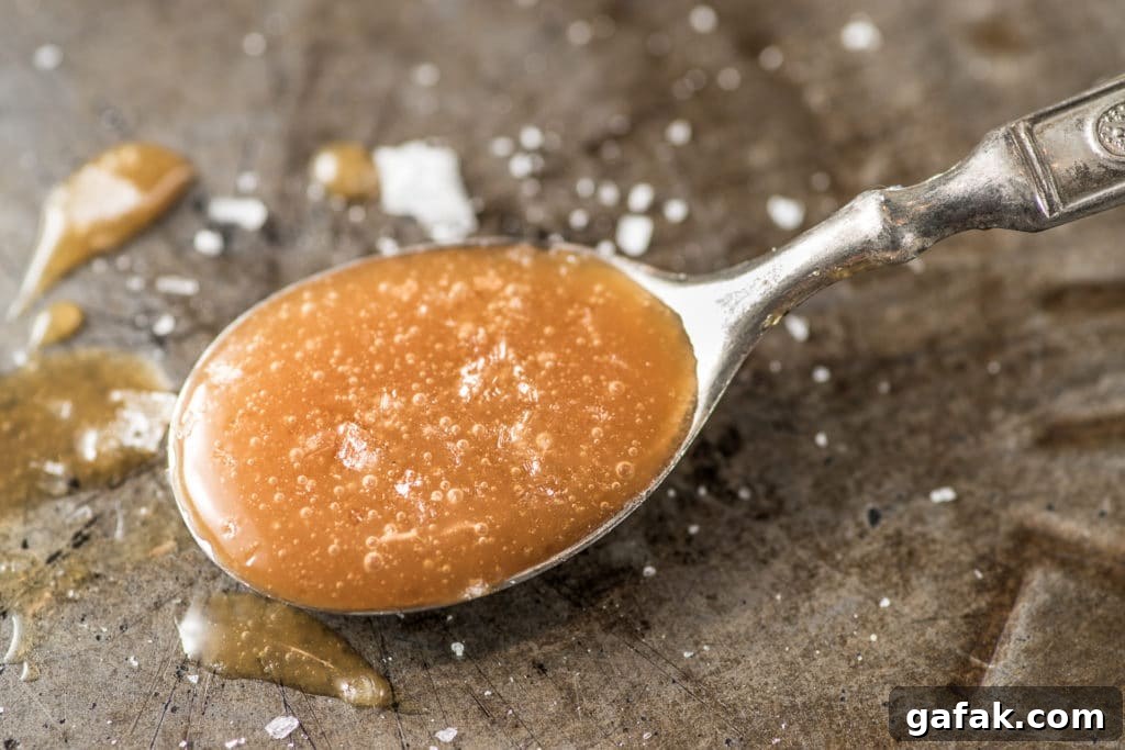 Low carb caramel made from allulose in a spoon.