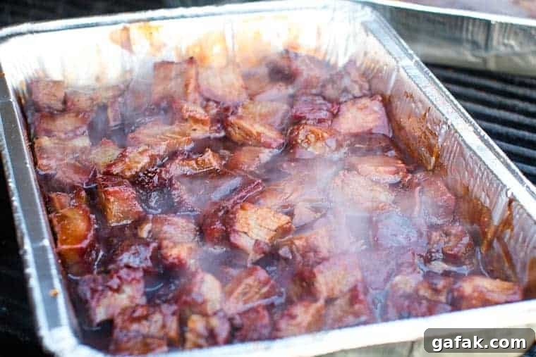 Affordable Burnt Ends Recipe: Crispy Smoky Beef Without Pitmaster Gear 3 Burnt Ends recipe in foil pan on traeger