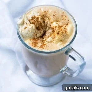 Paleo & keto pumpkin spice latte in a glass mug with whipped cream