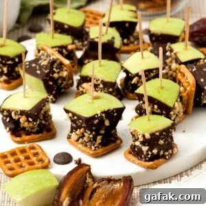 A batch of caramel apple pretzel bites with medjool dates and peanuts.