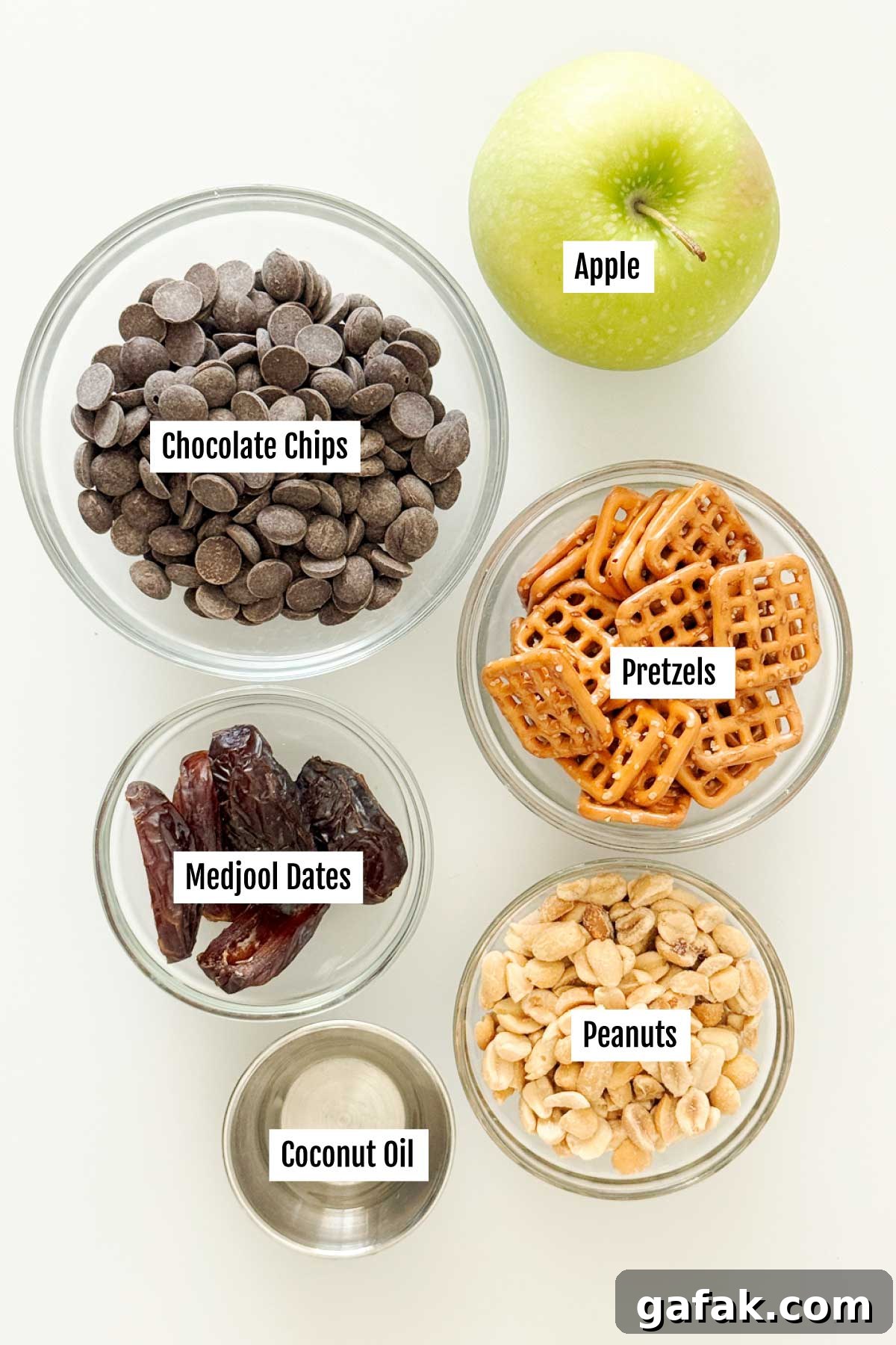 All the ingredients you need to make caramel apple pretzel bites with medjool dates, chocolate and peanuts.