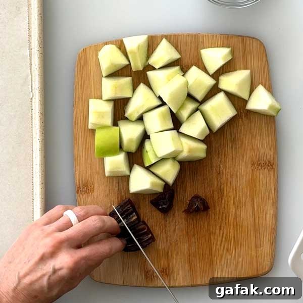 Chopping the apples and dates.