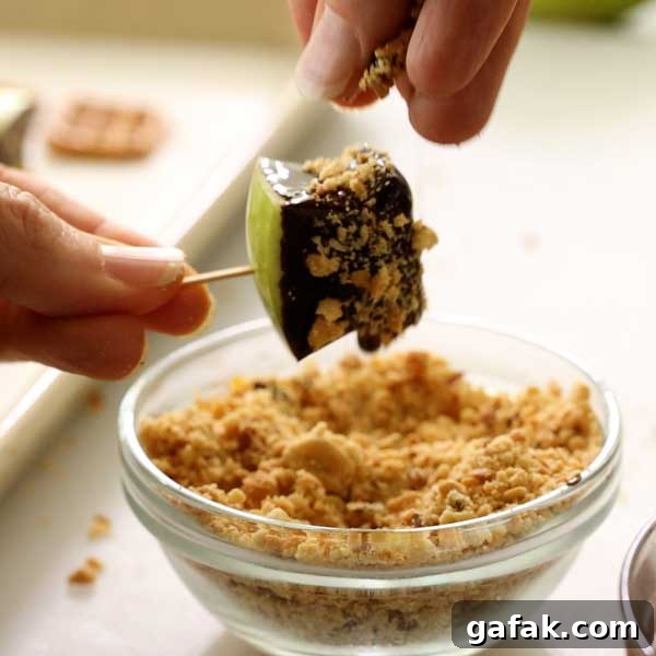 Sprinkling the crushed peanuts over the melted chocolate.