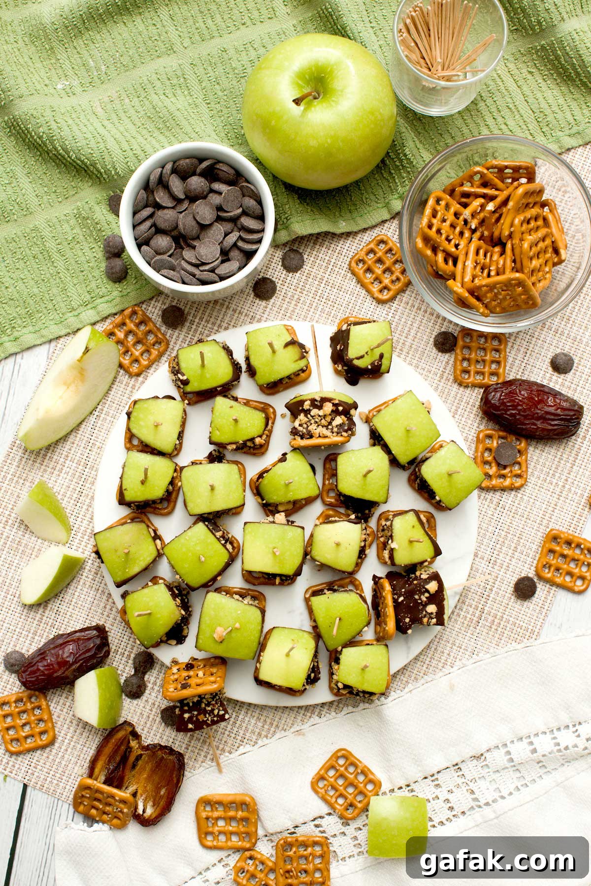 The top view of caramel apple pretzel bites with medjool dates and peanuts.