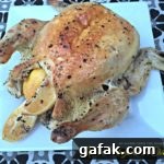 Chicken on a white serving platter with text "lemon mayonnaise chicken"