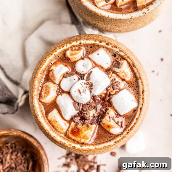 Overhead view of oat milk hot chocolate topped with marshmallows.