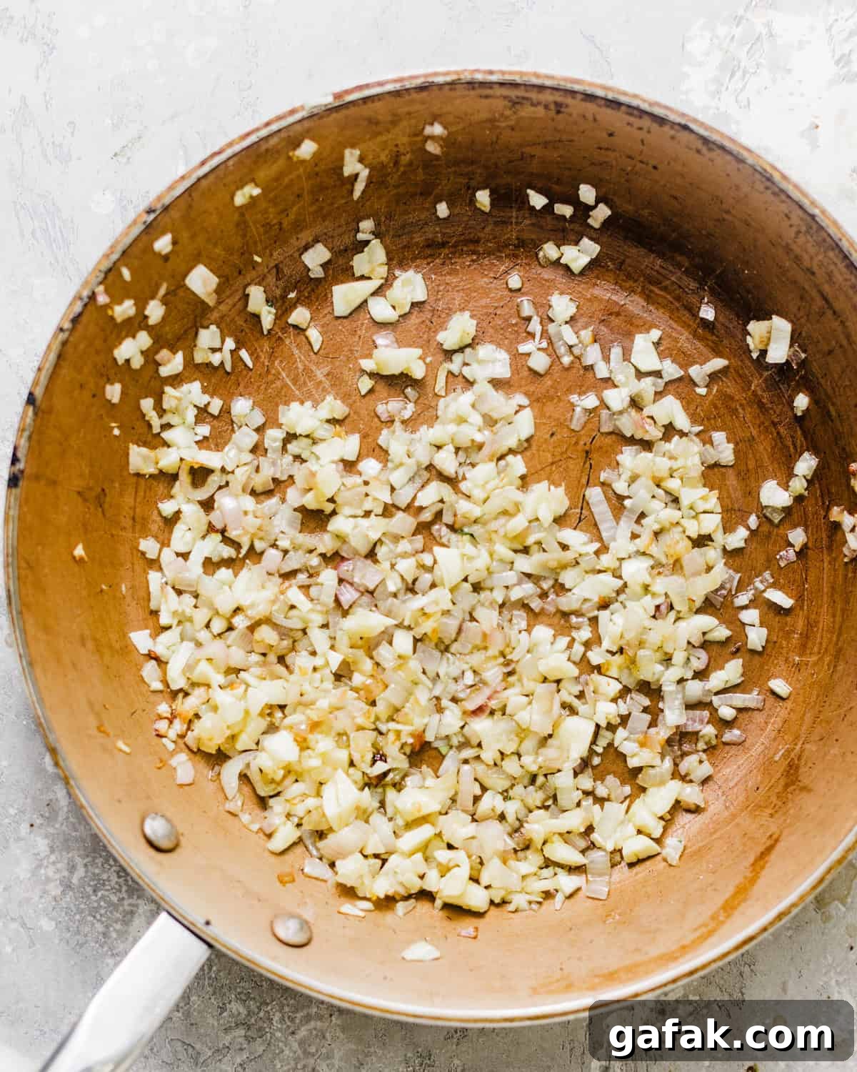 sauteed diced shallots and garlic in a skillet.