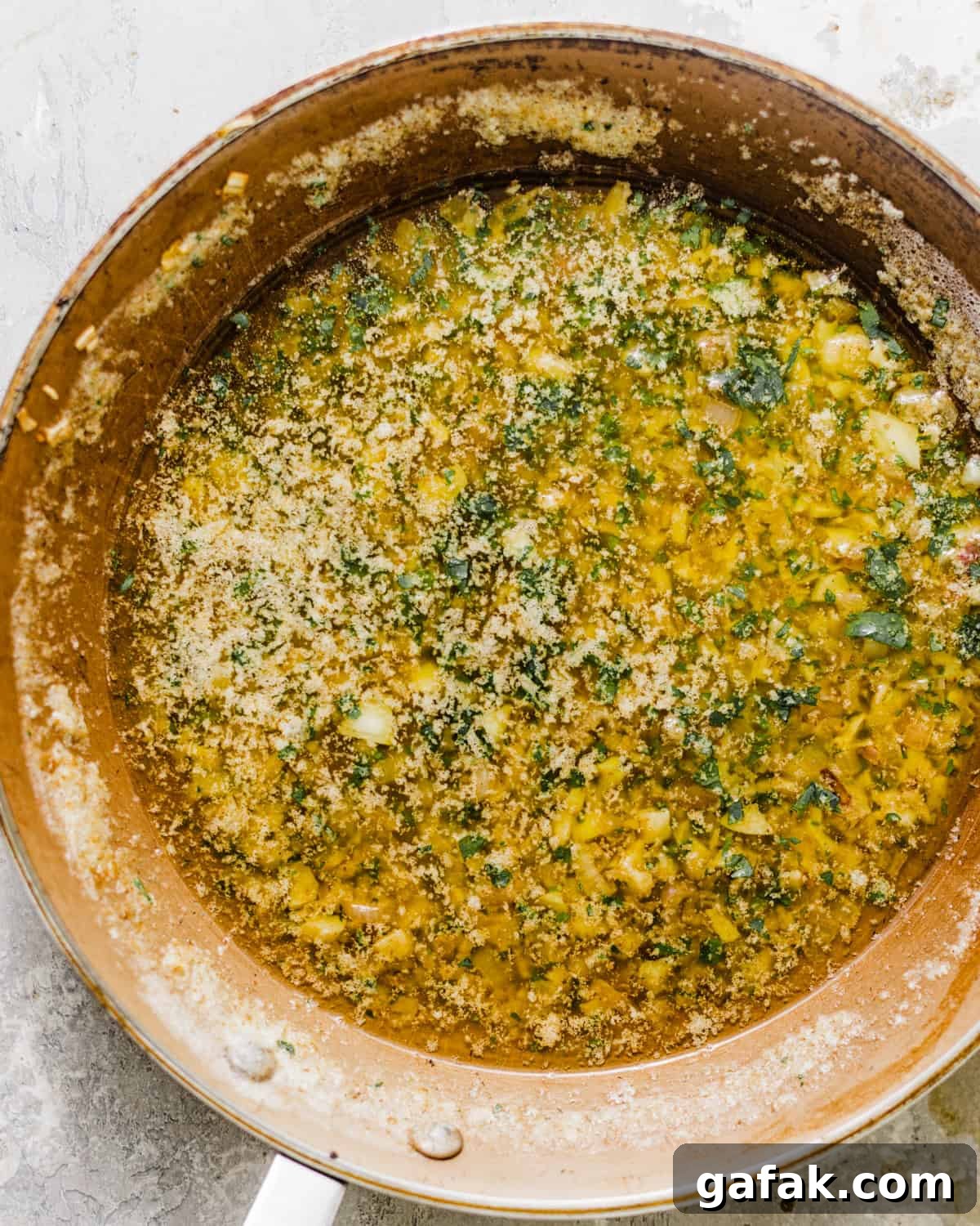 garlic butter sauce in a skillet.