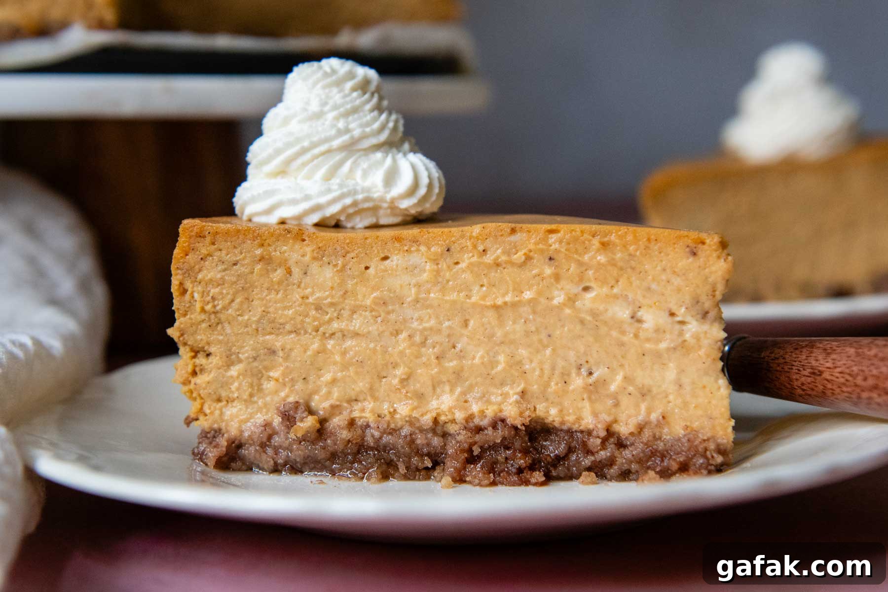 a slice of cheesecake on a white plate.
