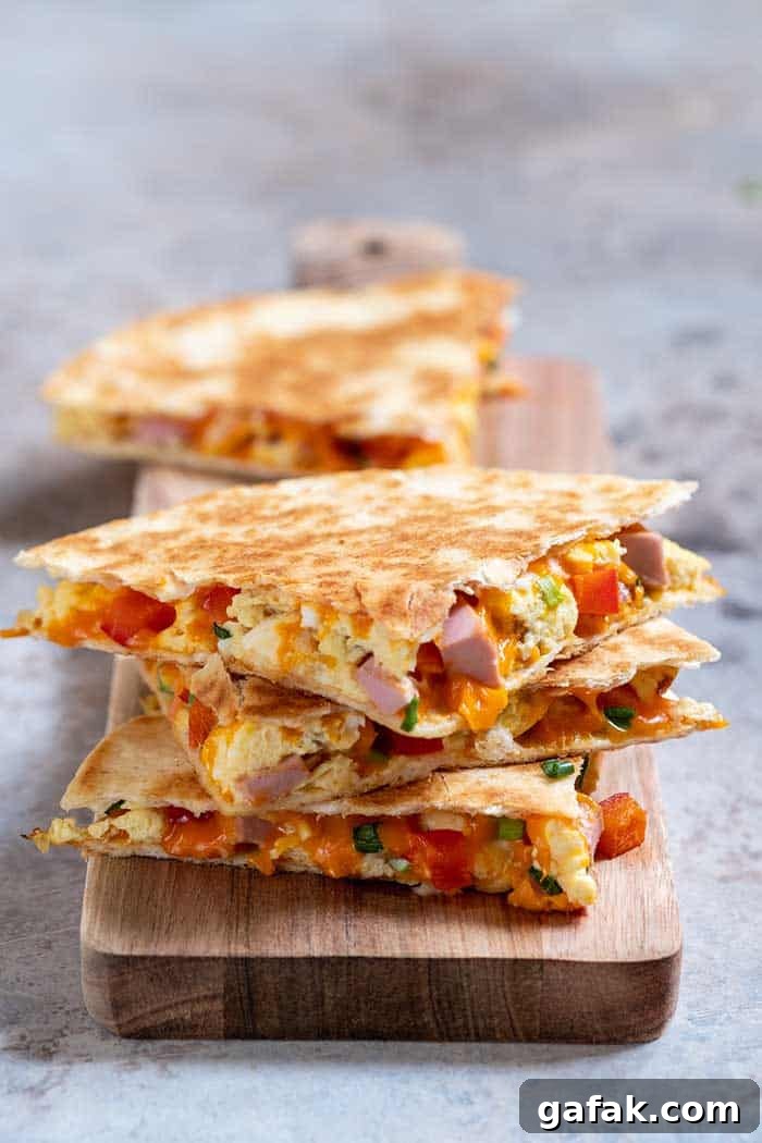 quesadilla with scramble eggs vegetables ham and cheese