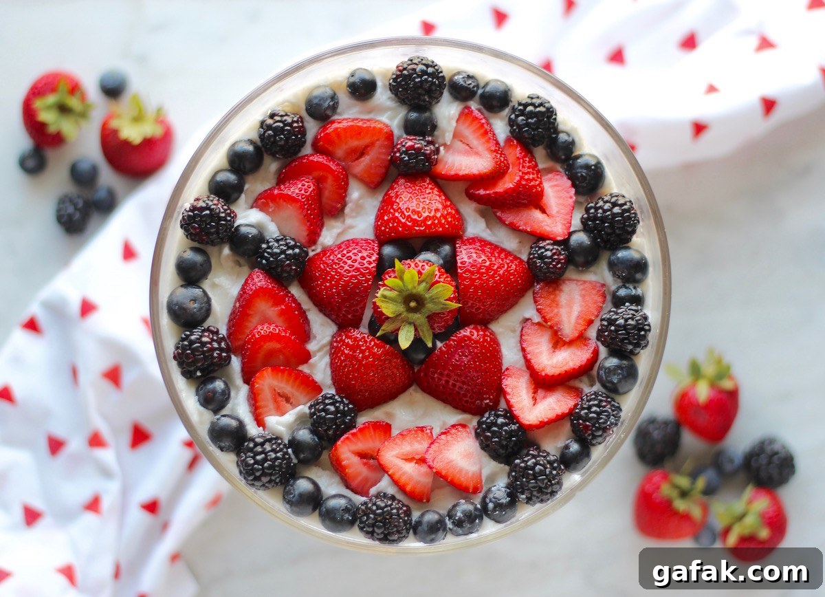 Paleo Triple Berry Trifle (AIP) - fresh berries, creamy coconut whip, and decadent pound cake come together in this magnificent summer dessert! | fedandfulfilled.com