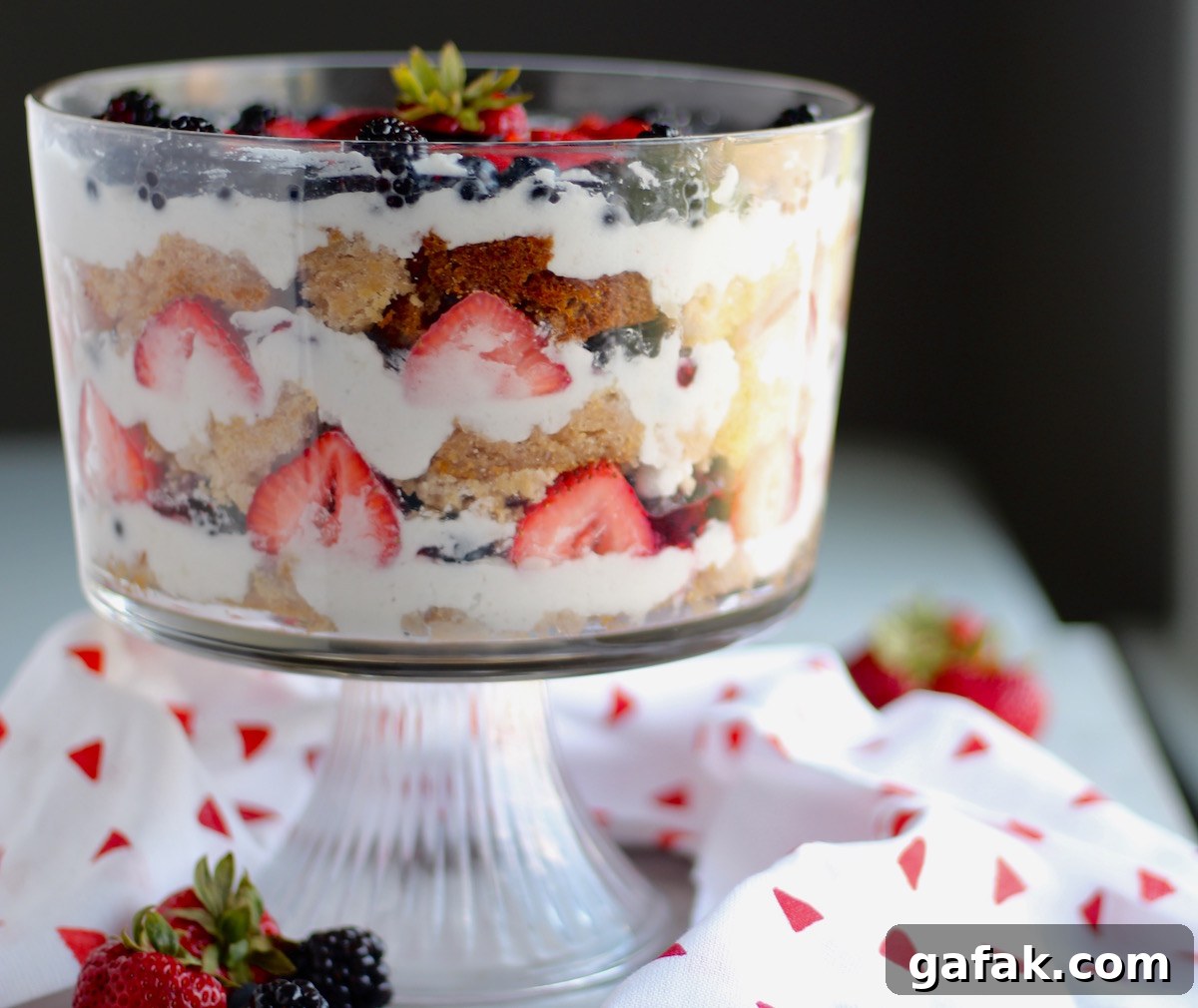 Paleo Triple Berry Trifle (AIP) - a mouth-watering array of berries, coconut cream, pound cake, and jam, all piled high into a decadent dessert! | fedandfulfilled.com
