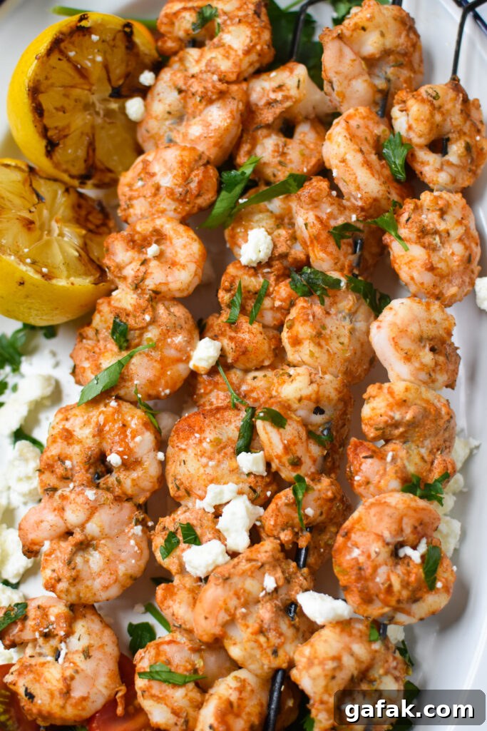 Mediterranean Grilled Shrimp Skewers on a white platter.