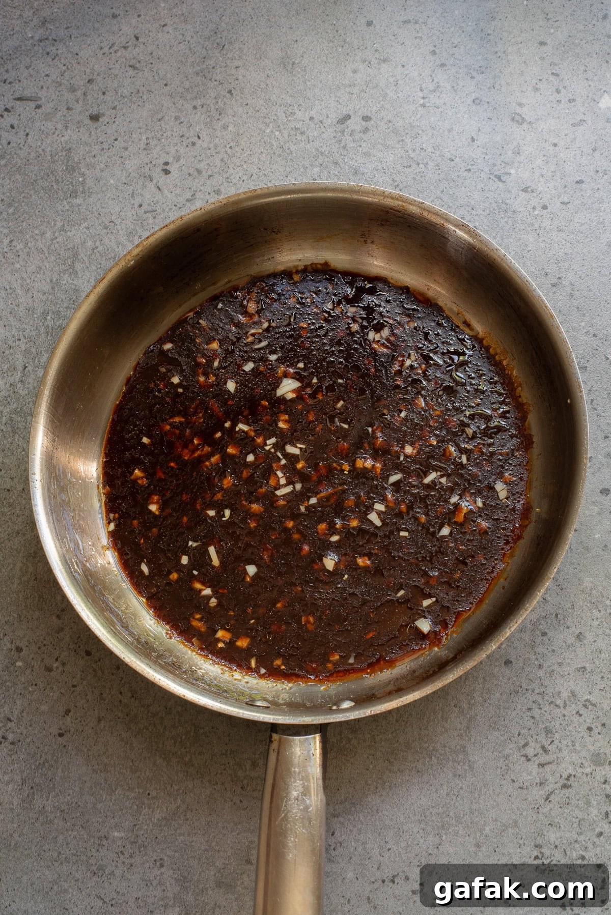 An overhead image of whipping up the sauce.